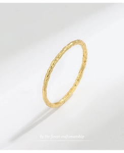 Detail showing the hammered texture of the minimalist golden S925 sterling silver thin ring