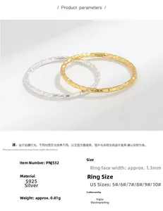 Detail showing S925 sterling silver rings with irregular hammered tin foil texture in gold