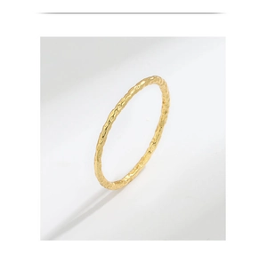 Close-up of gold S925 sterling silver ring with hammered tin foil texture finish