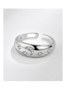 Close-up of S925 sterling silver ring featuring engraved star and moon patterns with zircons