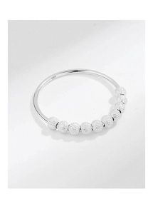 Macro detail of S925 sterling silver ring showing movable frosted beads and S925 hallmark