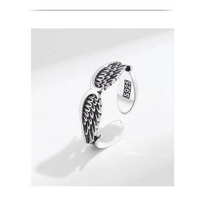 Detailed view of S925 sterling silver angel wing ring with vintage feather textures