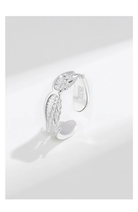 Macro shot of S925 sterling silver stamp on the detailed angel wing feather ring