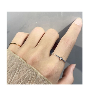 Close-up of minimalist S925 sterling silver thin rings in gold and silver finish
