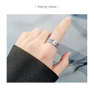 Detail view of S925 sterling silver ring with engraved Heart Sutra and wavy edges