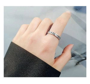 Close-up of S925 sterling silver ring featuring embossed Heart Sutra scripture detail