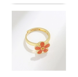 Macro detail of S925 sterling silver stamp on the gold-plated spinning flower ring
