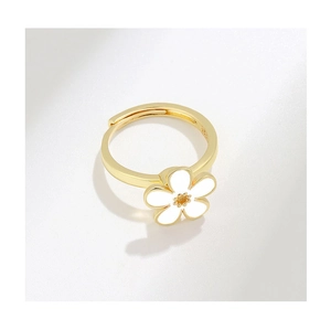 Macro shot of S925 sterling silver stamp and white enamel flower detail on ring
