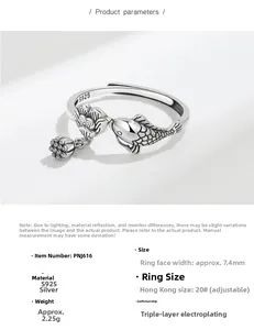 Macro detail of S925 sterling silver ring with koi fish and lotus pattern engraving