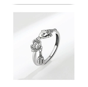Macro shot of S925 silver ring featuring vintage koi fish and lotus tassel detail