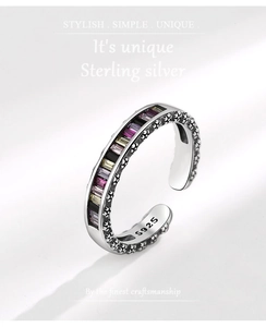 Macro shot of colorful zircon stones on S925 silver ring with vintage floral engravings