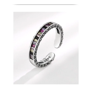 Close-up of S925 sterling silver ring with colorful zircons and floral textures
