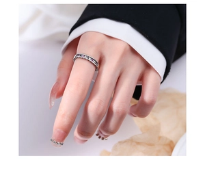Close-up of S925 silver ring with colorful rectangular zircons worn on finger