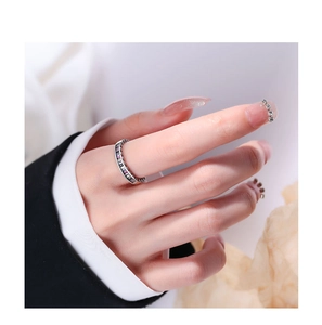 Close-up of S925 silver eternity ring with colorful rectangular-cut cubic zirconia gems