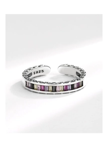 Macro detail of S925 sterling silver ring with colorful rectangular zircon and bead texture