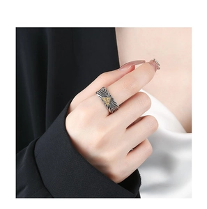 Detailed view of vintage silver Eye of Providence ring with golden triangle emblem