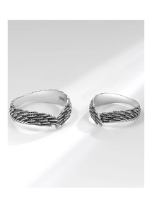 Close-up of S925 sterling silver feather couple rings with vintage oxidation detail
