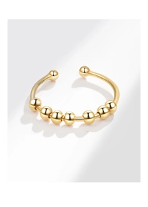 Detalle del sello S925 en el anillo giratorio antiestrés de plata bañada en oro