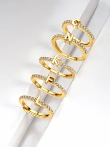 Macro view of five S925 sterling silver letter rings with micro-pave cubic zirconia crystals