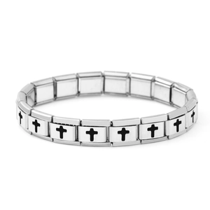 Macro shot of Italian charm bracelet links featuring black cross symbols on polished steel