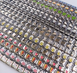 Close-up of various Italian charm links with colorful enamel patterns for modular bracelets