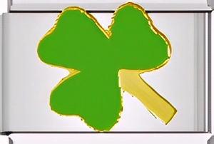Macro detail of Italian charm link featuring green clover inlay with golden metal edges