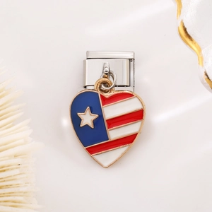 Close-up of heart-shaped USA flag charm on a stainless steel modular link bracelet