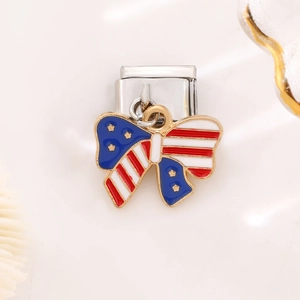 Macro view of Italian charm link featuring American flag enamel bow on stainless steel