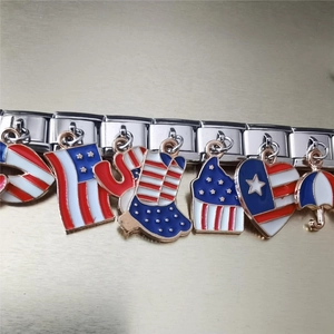 Close-up of USA flag enamel charms on a stainless steel Italian modular bracelet