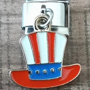 Macro shot of a modular Italian charm featuring a patriotic Uncle Sam hat in enamel
