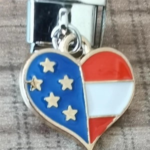 Macro shot of American flag heart charm in blue and red stripes for Italian link bracelets