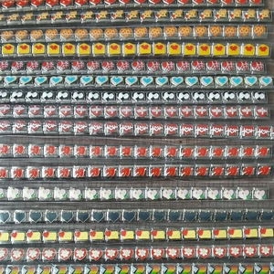Macro view of stainless steel Italian charm links featuring various colorful heart patterns