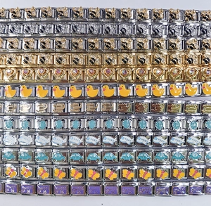 Macro display of diverse 9mm stainless steel Italian charm links with colorful enamel icons