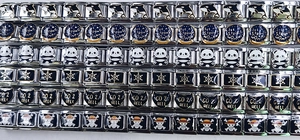 Detailed view of modular 9mm stainless steel Italian charms with enamel animal and slogan icons