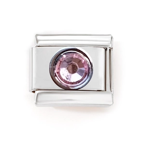 Close-up of an Italian charm bracelet link with a pink faceted crystal stone on steel