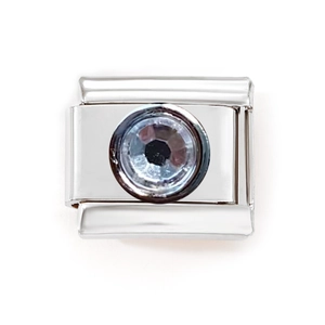 Detail of Italian charm bracelet link in stainless steel with a round clear crystal stone