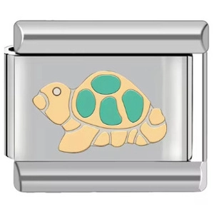 Detailed close-up of a silver stainless steel modular charm with a green turtle design