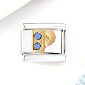 Detailed close-up of a silver modular charm with a gold letter P and blue zircon stones