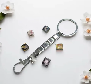 Detail of Italian charm keychain with colorful printed charms and lobster clasp