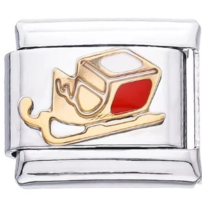Detail eines Weihnachts-Schlittenanhängers aus Edelstahl mit rotem und weißem Emaille-Dekor
