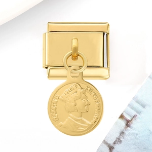Detailed macro shot of a gold-finish Italian charm with an Elizabeth II coin pendant