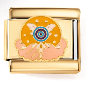 Detail of Italian charm modular link with golden Eye of Horus design and colorful enamel
