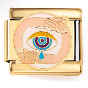Detailed view of Italian charm link featuring a golden sun and blue eye enamel pattern