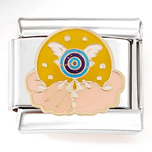 Close-up of Italian modular charm with enamel Eye of Horus and colorful wing motif