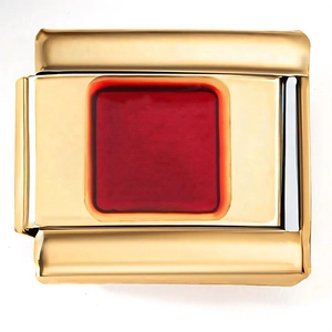 Macro view of 18K gold stainless steel charm link with a square dark red inlay