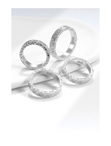 Macro view of S925 sterling silver rings showing detailed crushed ice texture and hallmark