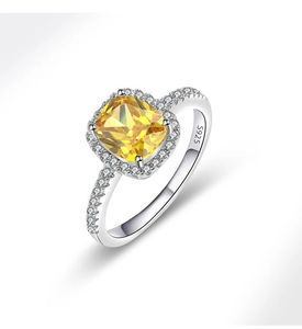 Macro view of S925 sterling silver ring with yellow cushion-cut stone and halo diamonds