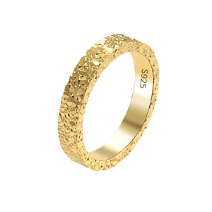 Golden S925 sterling silver ring with irregular crushed ice texture on white background