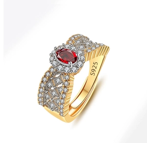 Macro shot of S925 silver hallmark and pave diamonds on luxury red gemstone ring