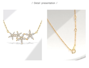 Macro detail of three-flower pendant with sparkling zircons and adjustable lobster clasp